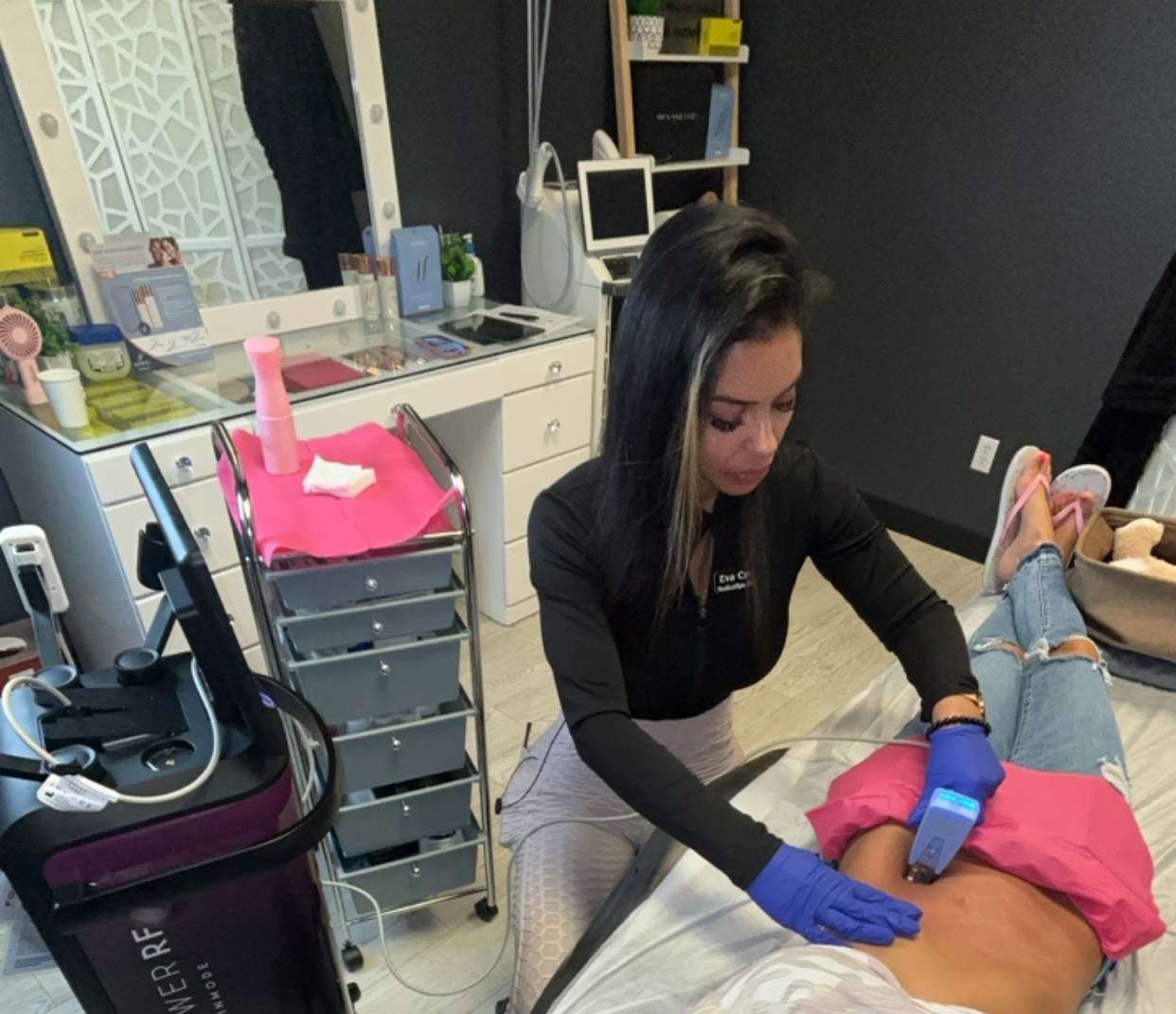 Eva performing a Morpheus8 Body treatment on a patient's abdomen at Grace MedSpa