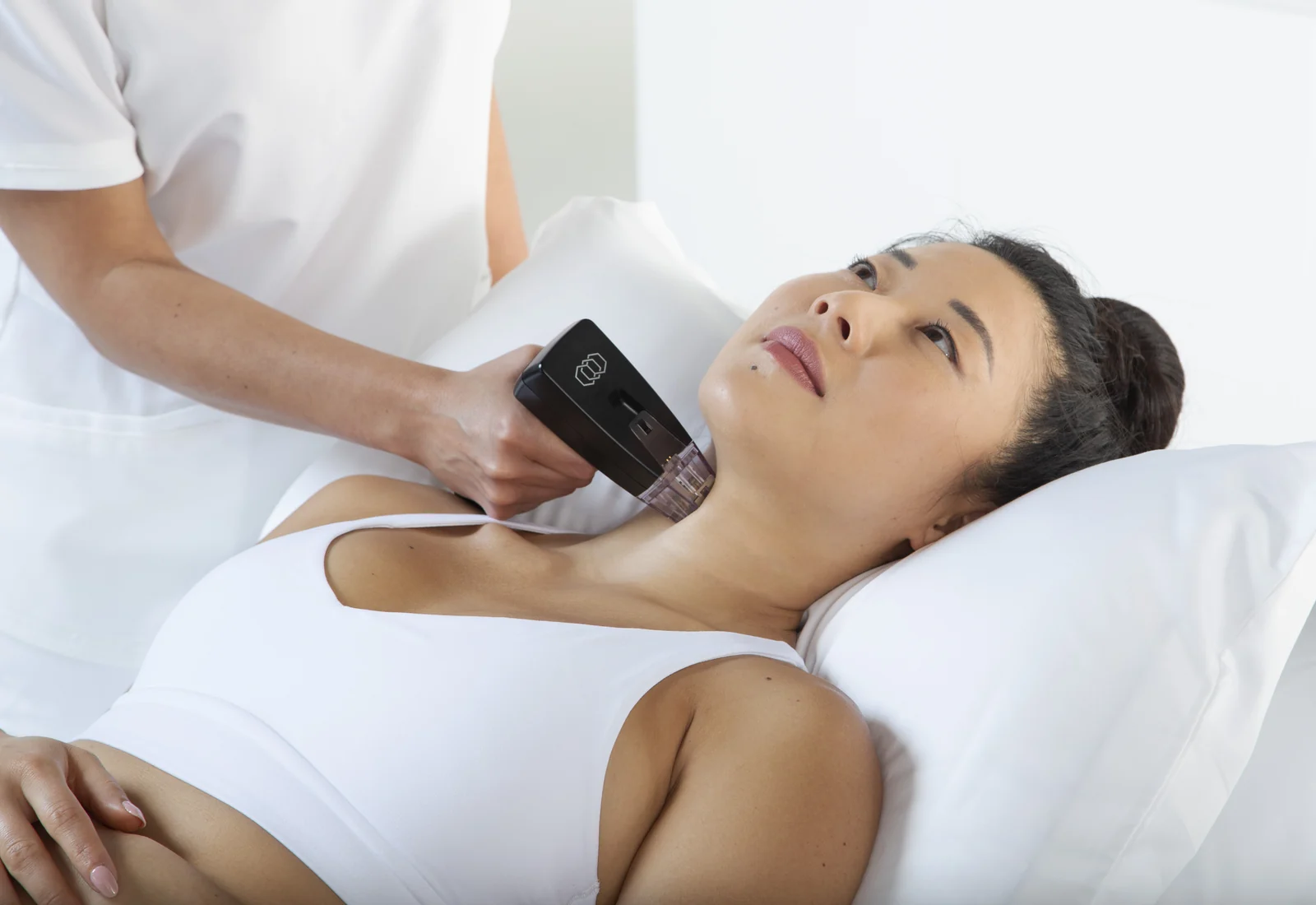 Manufacturer treatment photograph showing the Morpheus8 handpiece positioned at the neck