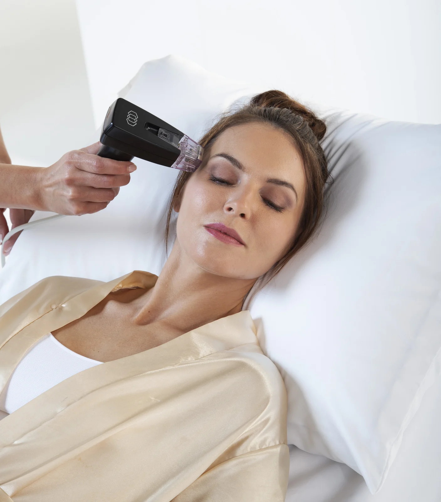Manufacturer treatment photograph showing the Morpheus8 handpiece positioned near the outer eye area